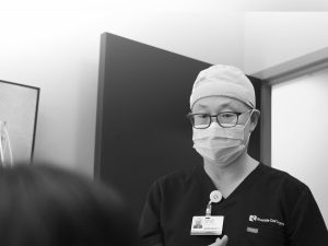 An oral surgeon having a conversation with a patient